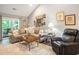 Cozy living room features a comfortable sofa and a decorative gallery wall at 2016 Willow Run Dr. # B, Little River, SC 29566
