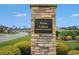 Stone pillar sign for Palm Lakes Garden Homes community, with manicured landscaping at 2016 Willow Run Dr. # B, Little River, SC 29566