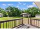 Expansive backyard with a shed, carport and a wooden deck perfect for outdoor activities and storage at 2096 Golden Leaf Rd., Galivants Ferry, SC 29544