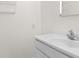 Bright bathroom with a white vanity sink and a simple mirror, offering a clean and functional space at 2096 Golden Leaf Rd., Galivants Ferry, SC 29544