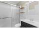 Updated bathroom featuring a shower with glass doors, floating shelves, and a modern vanity at 2096 Golden Leaf Rd., Galivants Ferry, SC 29544