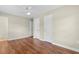 Bedroom with wood floors, neutral walls, ceiling fan and three closet doors for plenty of storage at 2096 Golden Leaf Rd., Galivants Ferry, SC 29544