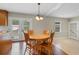 Cozy dining area with hardwood floors and a wooden table with chairs next to the kitchen at 2096 Golden Leaf Rd., Galivants Ferry, SC 29544
