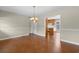 Charming dining area with wood floors and view of the kitchen with wood cabinets at 2096 Golden Leaf Rd., Galivants Ferry, SC 29544