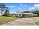 Inviting single-story home with a metal roof, brick accents and a covered carport on a well-sized lot at 2096 Golden Leaf Rd., Galivants Ferry, SC 29544