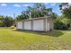 Large three-car garage featuring multiple roll-up doors and ample space for vehicles and storage at 2096 Golden Leaf Rd., Galivants Ferry, SC 29544