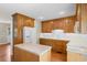 Traditional kitchen featuring wood cabinets, a white refrigerator and a center island with storage at 2096 Golden Leaf Rd., Galivants Ferry, SC 29544