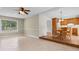 Bright living room adjacent to the dining area and kitchen, with ample natural light at 2096 Golden Leaf Rd., Galivants Ferry, SC 29544