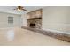 Spacious living room featuring a brick fireplace and neutral-toned tile flooring at 2096 Golden Leaf Rd., Galivants Ferry, SC 29544