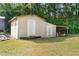 Backside of outbuilding with two doors and a lean-to, perfect for storage or workshop space at 2096 Golden Leaf Rd., Galivants Ferry, SC 29544