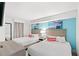 Comfortable bedroom with two beds, decorative paintings and side table at 2301 S Ocean Blvd. # 621, Myrtle Beach, SC 29577