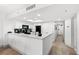 A clean kitchen with an island countertop, white cabinets, and modern appliances at 2301 S Ocean Blvd. # 621, Myrtle Beach, SC 29577