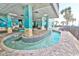 Unique under building lazy river pool area with seating and murals at 2301 S Ocean Blvd. # 621, Myrtle Beach, SC 29577