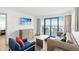 Comfortable living room with a flat-screen TV and sliding glass doors to a balcony at 2301 S Ocean Blvd. # 621, Myrtle Beach, SC 29577