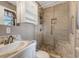 Bathroom featuring tiled shower and floors, modern fixtures and built-in storage at 2519 Reta St., Conway, SC 29526