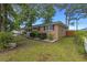 Well-maintained lawn surrounds brick home with manicured landscaping and classic shutters at 2519 Reta St., Conway, SC 29526
