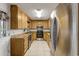 Well-organized kitchen featuring stainless steel appliances and lots of wood cabinet storage space at 2519 Reta St., Conway, SC 29526