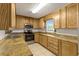 Traditional kitchen featuring wood cabinets, modern stainless steel appliances, and tiled flooring at 2519 Reta St., Conway, SC 29526