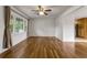 This living room has hardwood floors, a ceiling fan, and large bright windows at 2519 Reta St., Conway, SC 29526
