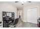 Bedroom featuring a makeup vanity, closet, neutral walls, and wood-look flooring at 2521 Wise Rd., Conway, SC 29526