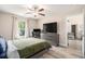 Comfortable bedroom with wood-look flooring, large window, and modern furniture at 2521 Wise Rd., Conway, SC 29526