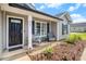 Inviting front porch with rocking chairs and a small table, perfect for relaxing outside at 2521 Wise Rd., Conway, SC 29526