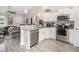 Bright kitchen featuring a stainless steel dishwasher and granite countertops open to the living room at 2521 Wise Rd., Conway, SC 29526