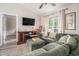 Comfortable living area features a large sectional, vaulted ceilings, and natural light from the windows at 2521 Wise Rd., Conway, SC 29526
