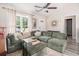 Cozy living room showcasing a large sectional sofa, neutral paint colors, and a ceiling fan at 2521 Wise Rd., Conway, SC 29526