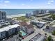 Aerial view shows the condo complex amenities, beachfront location, and nearby cityscape at 2710 South Ocean Blvd. # 208, Myrtle Beach, SC 29577