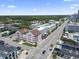 Overhead shot shows the complex and surrounding cityscape with nearby townhouses and a beach within view at 2710 South Ocean Blvd. # 208, Myrtle Beach, SC 29577
