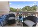 Balcony view featuring outdoor seating and glimpses of the pool in a vibrant neighborhood setting at 2710 South Ocean Blvd. # 208, Myrtle Beach, SC 29577