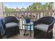 Balcony featuring outdoor seating, flowers, and glimpses of the surrounding neighborhood with palm trees at 2710 South Ocean Blvd. # 208, Myrtle Beach, SC 29577