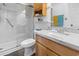Bathroom features a walk-in shower, a marble countertop, and stylish wooden cabinetry at 2710 South Ocean Blvd. # 208, Myrtle Beach, SC 29577