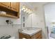 Cozy bathroom features a marble countertop, wood cabinetry, and decorative elements at 2710 South Ocean Blvd. # 208, Myrtle Beach, SC 29577