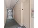 Hallway leading to the elevators, with a view of lush green trees at 2710 South Ocean Blvd. # 208, Myrtle Beach, SC 29577