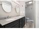 Bathroom with a double sink vanity, granite countertops, and decorative mirrors at 299 Lake Arrowhead Rd., Myrtle Beach, SC 29572