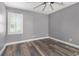 Bedroom showcasing a window with blinds and wood-look flooring at 299 Lake Arrowhead Rd., Myrtle Beach, SC 29572