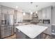 Modern kitchen featuring gray cabinets, stainless steel appliances, and a large center island at 299 Lake Arrowhead Rd., Myrtle Beach, SC 29572