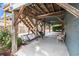 Outdoor lounge area with a porch swing and chairs at 299 Lake Arrowhead Rd., Myrtle Beach, SC 29572