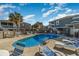 Community pool area surrounded by seating and multi-level homes at 299 Lake Arrowhead Rd., Myrtle Beach, SC 29572