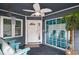 Inviting screened-in porch with ceiling fan, coastal decor, and comfortable seating at 299 Lake Arrowhead Rd., Myrtle Beach, SC 29572