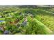 Scenic aerial view of a golf course community surrounded by lush green trees and fairways at 2995 Woodberry Ct., Little River, SC 29566