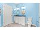 Bright bathroom with a double vanity, white cabinets, granite countertops, and updated fixtures at 2995 Woodberry Ct., Little River, SC 29566