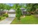 Well-maintained brick home with an attached garage and a neatly landscaped front yard at 2995 Woodberry Ct., Little River, SC 29566