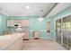 Bright kitchen with ample counter space, light wood cabinets, and sliding glass doors at 2995 Woodberry Ct., Little River, SC 29566