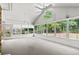Bright sunroom with large windows providing scenic views and natural light at 2995 Woodberry Ct., Little River, SC 29566