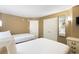 A full view of the bedroom with two beds and dresser with a mirror at 304 North Ocean Blvd. # 506, North Myrtle Beach, SC 29582