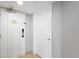 A full view of the suite entrance with tile floor and white doors at 304 North Ocean Blvd. # 506, North Myrtle Beach, SC 29582