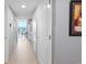 A full view of the hallway leading to the outdoor balcony and view of the ocean at 304 North Ocean Blvd. # 506, North Myrtle Beach, SC 29582